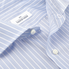 Close-up of the Blue Wide Striped Cotton Single Cuff Shirt by Alessandro Gherardi, showcasing its light blue and white stripes and cut-away collar. Crafted from pure cotton, it features elegant white buttons for a classic look.