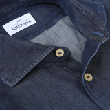 Close-up of an Alessandro Gherardi Dark Blue Cotton Denim Single Cuff Shirt with tan buttons, featuring a label that reads "Alessandro Gherardi.