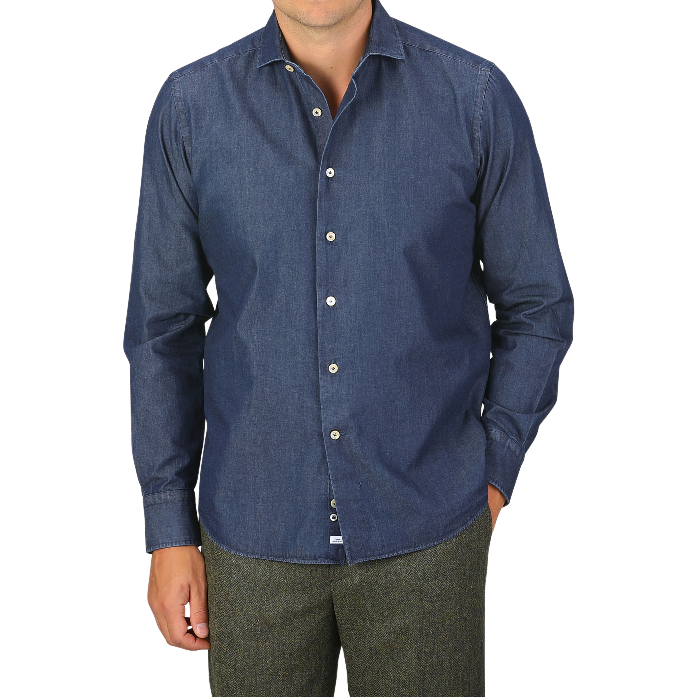 A person is wearing an Alessandro Gherardi Dark Blue Cotton Denim Single Cuff Shirt with brown trousers. The image is cropped at the neck and thighs.