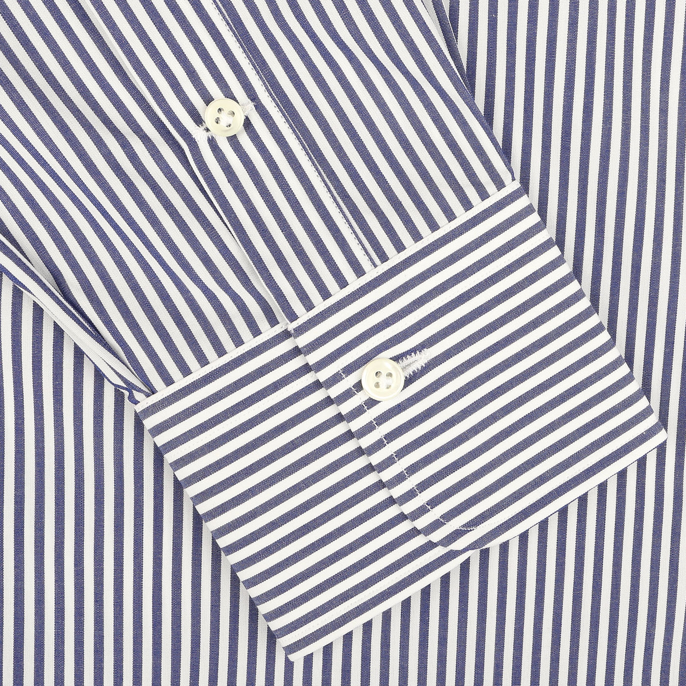 Close-up of an Alessandro Gherardi Dark Blue Striped Cotton Single Cuff Shirt sleeve, showcasing a buttoned cuff and made from pure cotton.