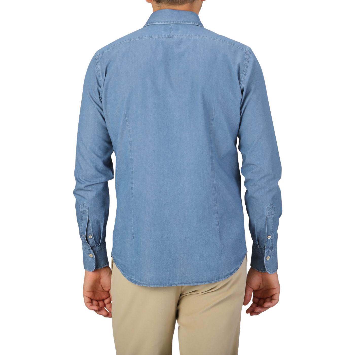 A person is standing with their back facing the camera, wearing an Alessandro Gherardi Light Blue Cotton Denim Single Cuff Shirt and beige pants.