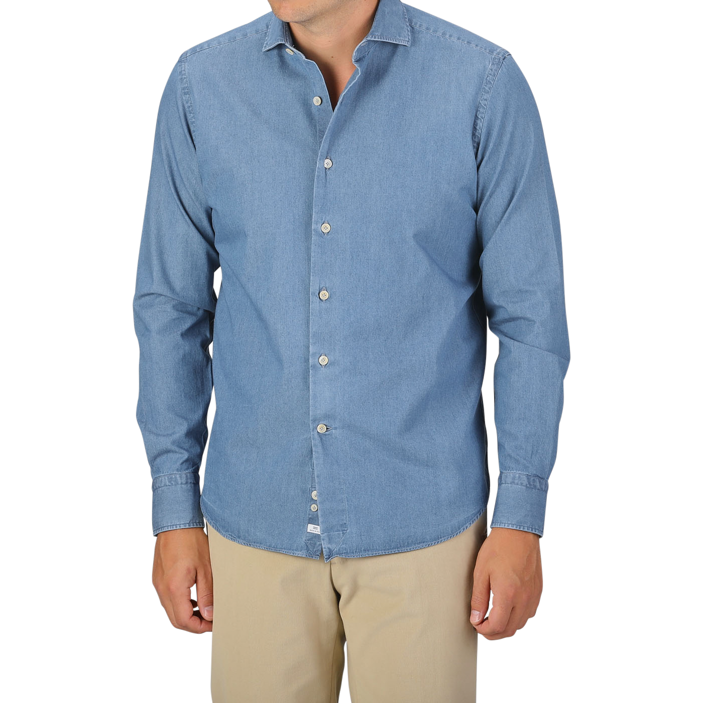 A person wearing an Alessandro Gherardi Light Blue Cotton Denim Single Cuff Shirt and beige pants stands against a plain background. Their head is not visible in the frame.