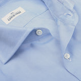 Close-up of a light blue Alessandro Gherardi Cotton Oxford Single Cuff Shirt, showcasing the collar, button details, and brand label, crafted from pure cotton.