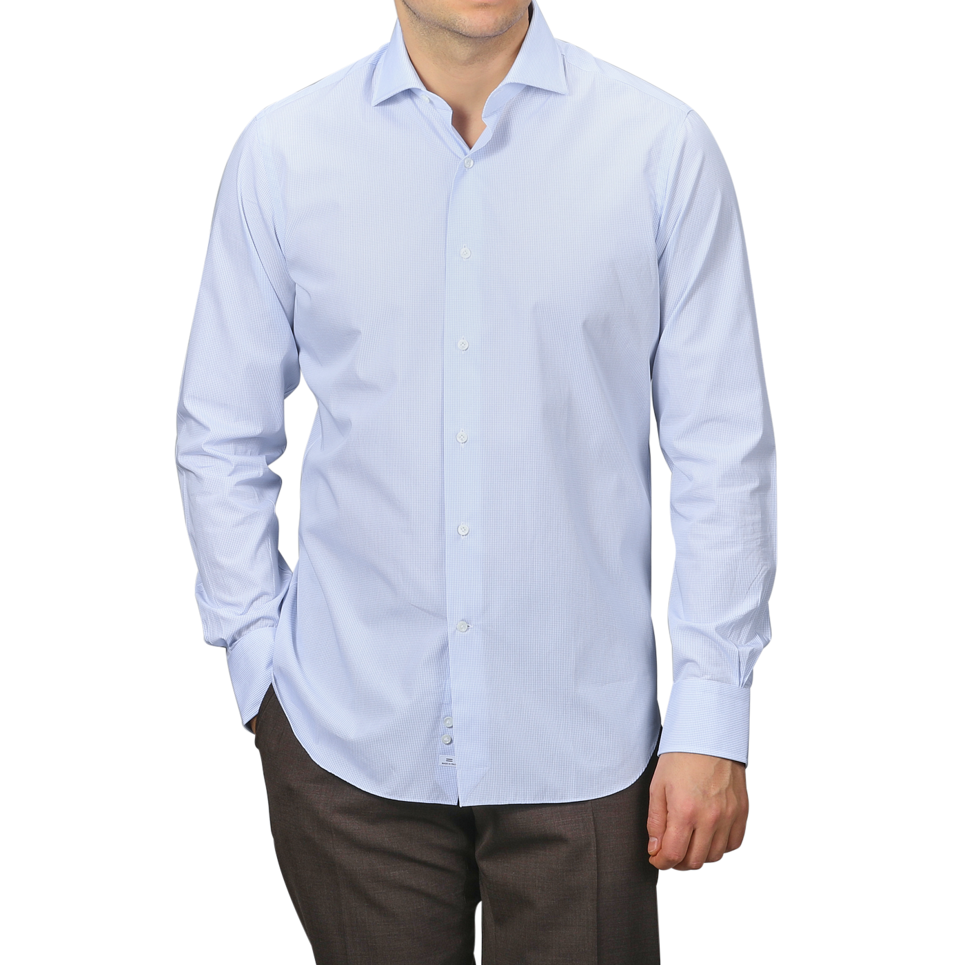 Someone wearing an Alessandro Gherardi light blue grid-checked cotton single cuff shirt with long sleeves and dark pants, standing neutrally.