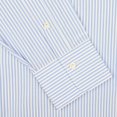 Close-up view of an Alessandro Gherardi Light Blue Striped Cotton Single Cuff Shirt sleeve, with a buttoned cuff, perfect for men's formal wear.