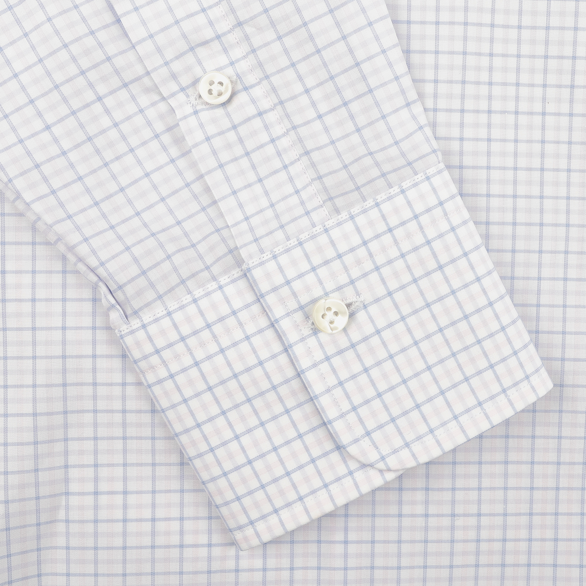 Close-up of a sleeve from Alessandro Gherardi's Pink Blue Gingham Checked Cotton BD Shirt, highlighting the light blue grid pattern on pure cotton fabric and buttoned cuff.