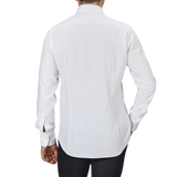 A person wearing an Alessandro Gherardi White Cotton Twill Single Cuff Shirt and black pants, viewed from the back against a plain gray background.