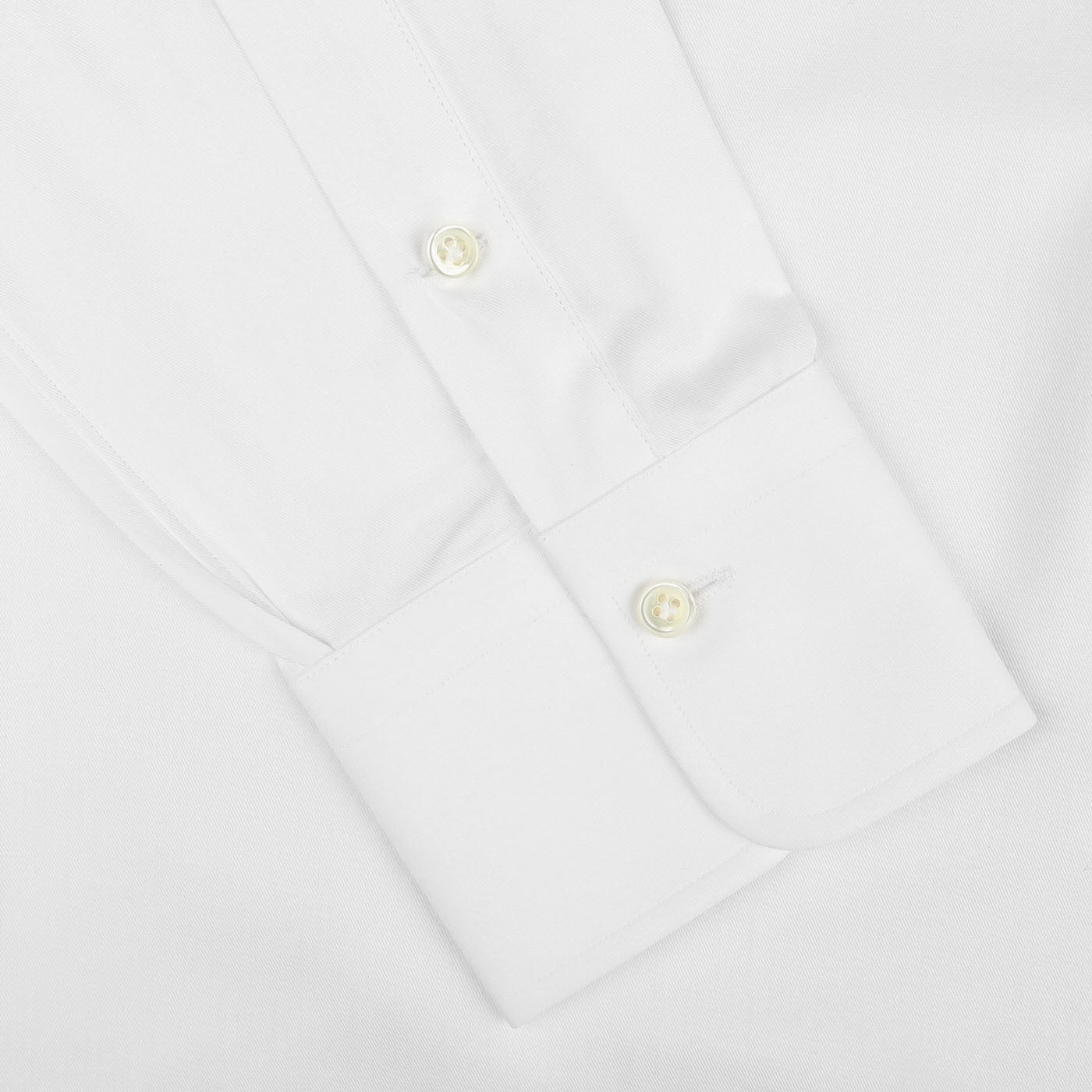 Close-up view of an Alessandro Gherardi White Cotton Twill Single Cuff Shirt sleeve with two buttons on the cuff.