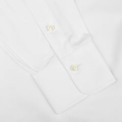 Close-up view of an Alessandro Gherardi White Cotton Twill Single Cuff Shirt sleeve with two buttons on the cuff.