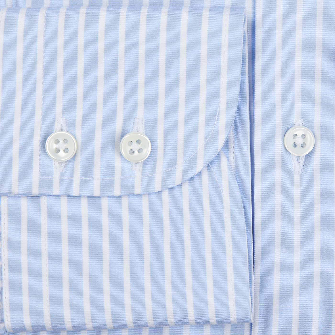 A close up of a Blue White Striped Egyptian cotton shirt with mother-of-pearl buttons by Alexander Kraft Monte Carlo.