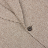 A close up of a Beige Herringbone Wool Linen Provence Jacket from Alexander Kraft Monte Carlo.