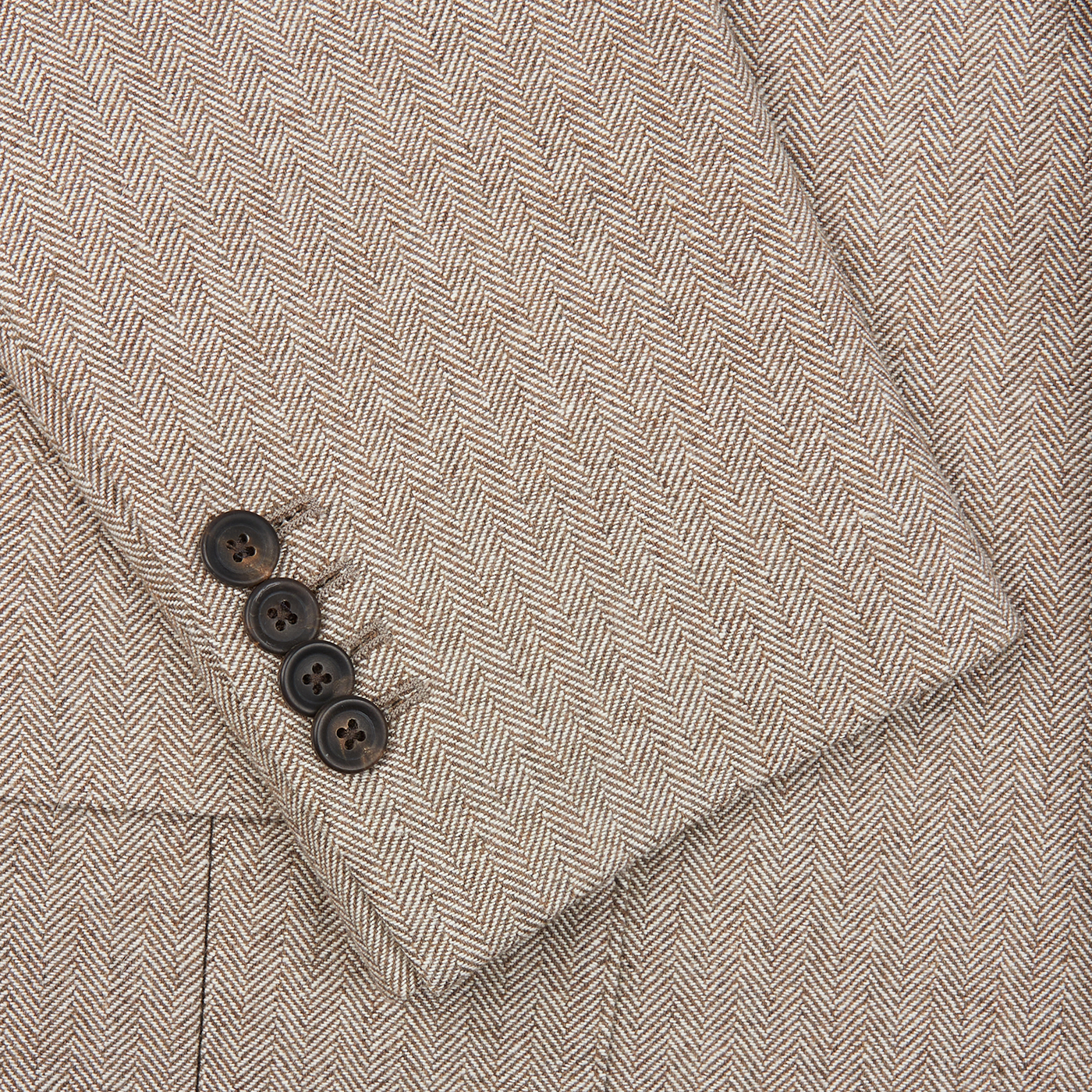 A close up of a Beige Herringbone Wool Linen Provence Jacket by Alexander Kraft Monte Carlo.