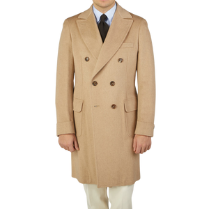 A man wearing an Alexander Kraft Monte Carlo Camel Beige Pure Cashmere Florence DB Overcoat.