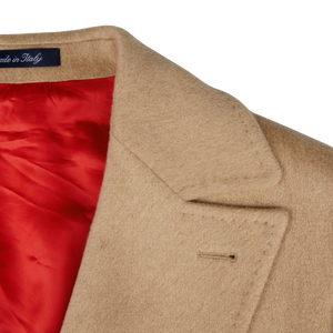 An Alexander Kraft Monte Carlo Camel Beige Pure Cashmere Florence DB Overcoat with a red lining.