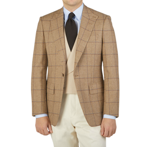 A man wearing an Alexander Kraft Monte Carlo Caramel Estate Wool Tweed Provence Jacket.