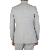 The back view of a man wearing an Alexander Kraft Monte Carlo Light Grey VBC Wool Flannel Signature Jacket.