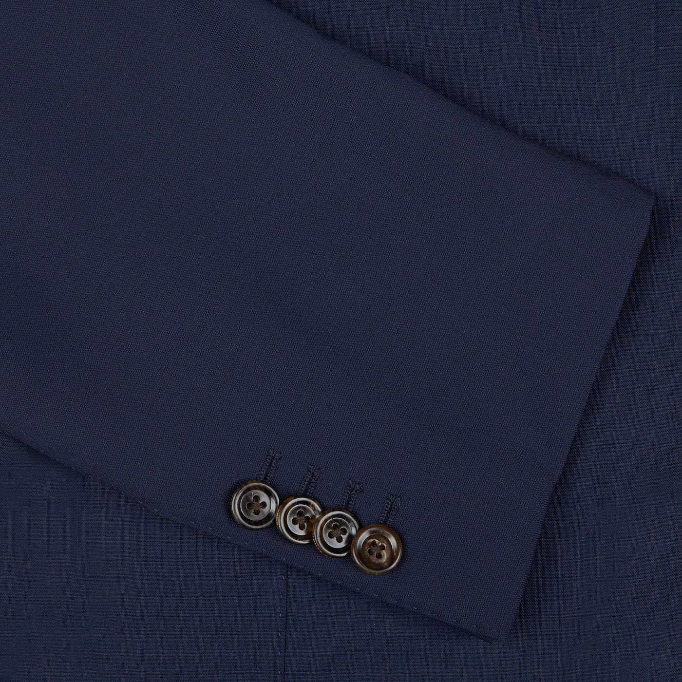A close up of an Alexander Kraft Monte Carlo Navy Blue Loro Piana Wool Unstructured PPJ Jacket with buttons.