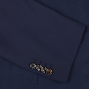 A close up of an Alexander Kraft Monte Carlo Navy Blue Loro Piana Wool Unstructured PPJ Jacket with buttons.