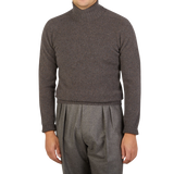 A man wearing a Brown Melange Wool Cashmere Rollneck sweater from the Italian brand Altea.