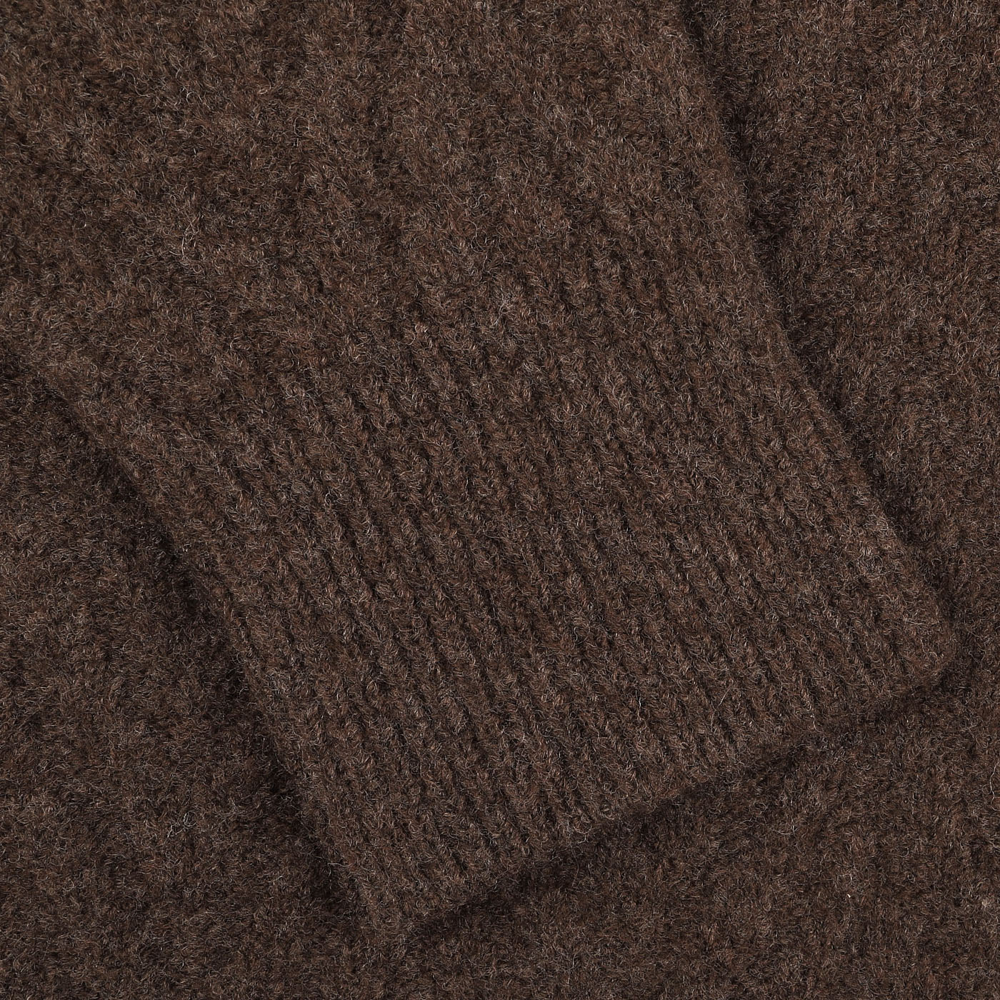 Close-up image of the Altea Brown Wool Chevron Knit V-Neck sweater showcasing a chevron-knit cuff pattern.