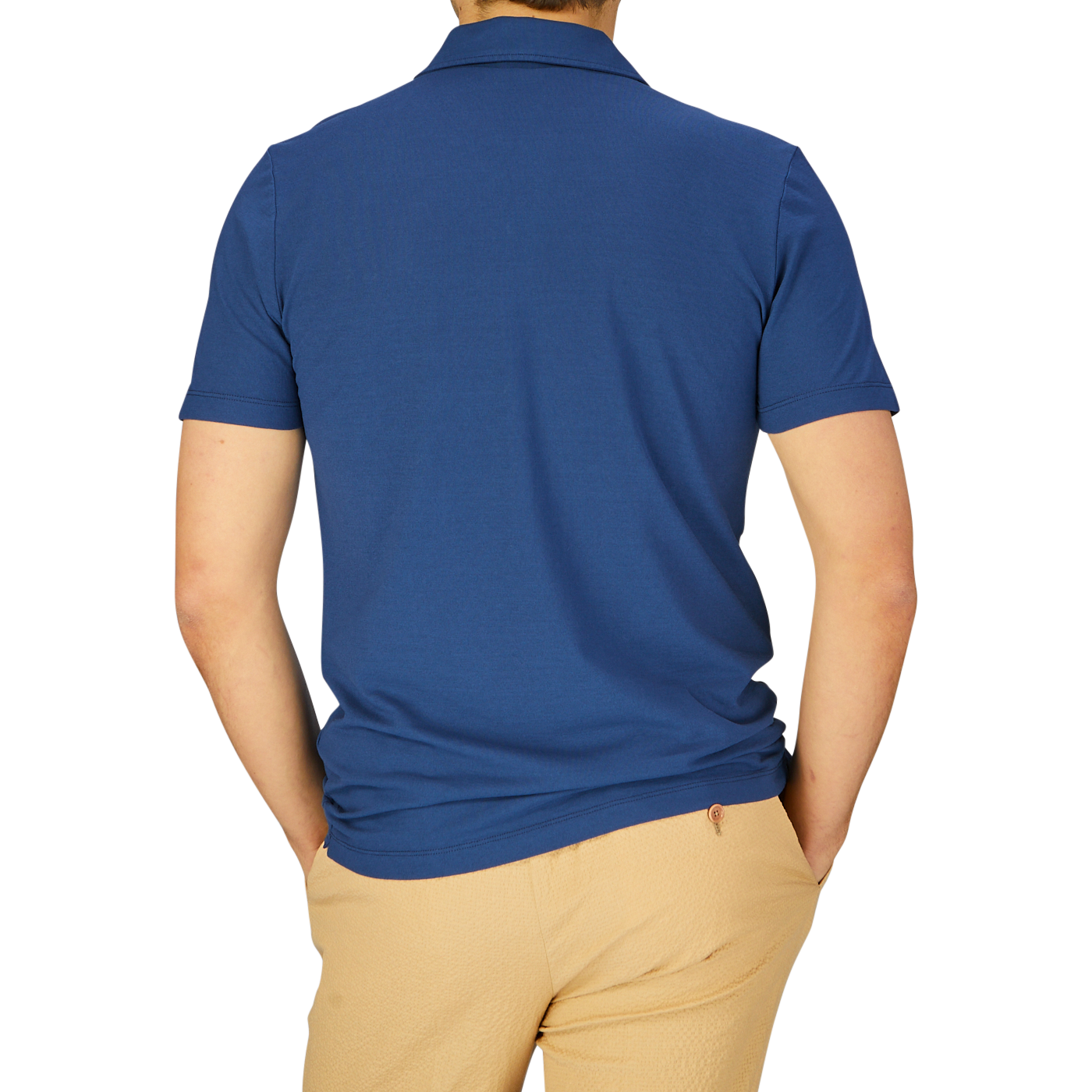 A man seen from the back wearing an Altea dark blue cotton jersey capri collar polo shirt and beige pants.