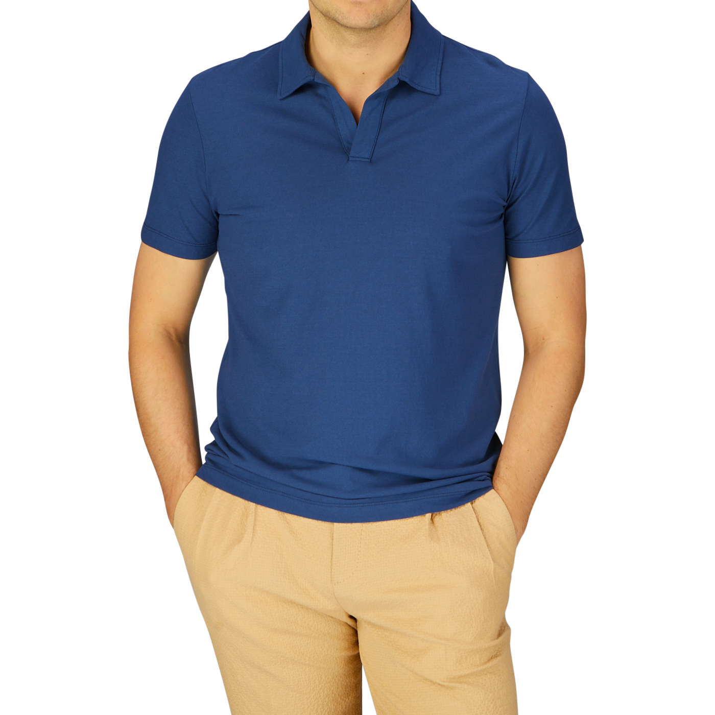 Man wearing a slim fit Altea dark blue cotton jersey Capri collar polo shirt and beige trousers.