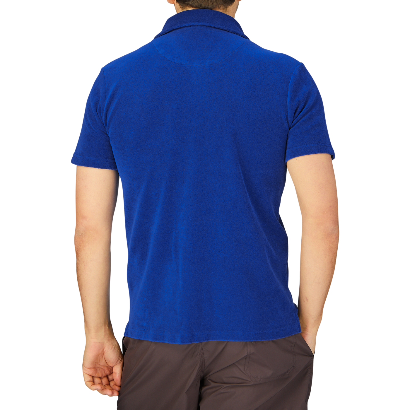 Rear view of a person wearing a dark blue Altea Organic Cotton Capri Collar Polo Shirt and brown trousers.