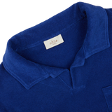 Close-up of a dark blue Altea Cotton Towelling Capri Collar Polo Shirt with a visible brand label on the collar.