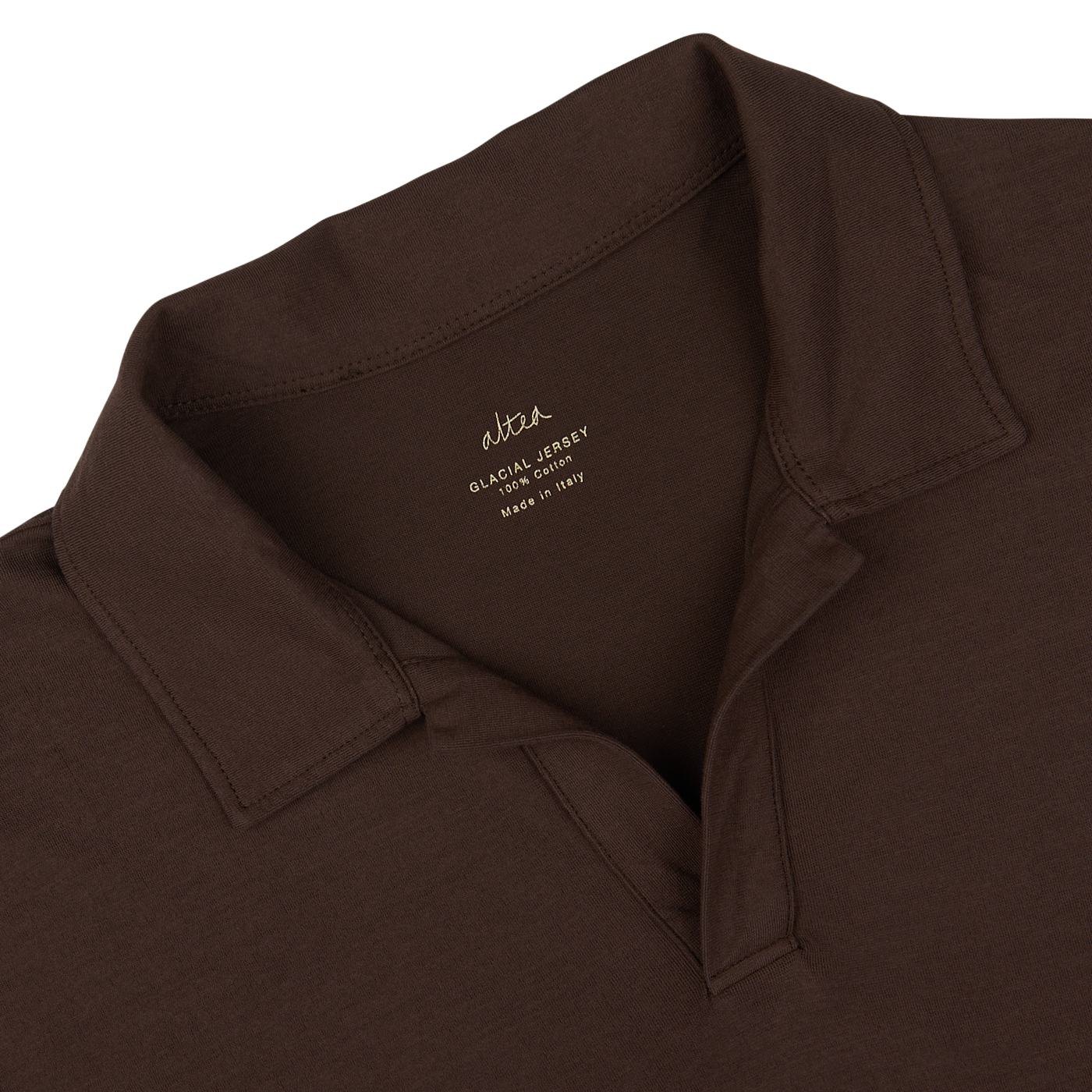 Close-up of a dark brown Altea Cotton Jersey Capri Collar Polo Shirt with a tag showing the brand and material details of the seasonal polo shirt.