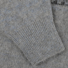 Close-up of a grey melange knitted fabric, highlighting the texture and the cuff of a sleeve from the Altea Grey Melange Norwegian Wool Alpaca Crewneck sweater.