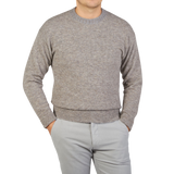 A man wearing an Altea Grey Melange Wool Alpaca Crewneck Sweater.