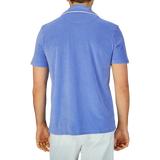 Man from behind wearing an Altea light blue cotton  Towelling Capri collar shirt and white trousers.