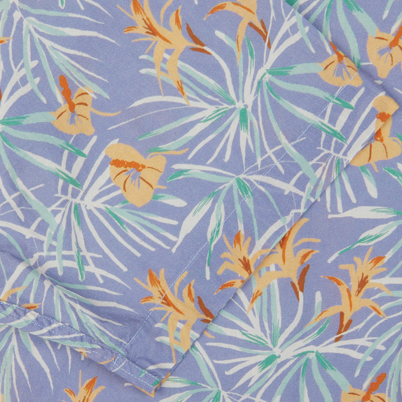 A close-up of an Altea Light Blue Floral Printed Cotton Shirt with a tropical design, featuring palm leaves and butterflies on a lavender background, perfect as a summer essential.