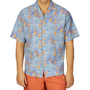 A person wearing a Light Blue Floral Printed Cotton Shirt by Altea and orange pants, a summer essential outfit.