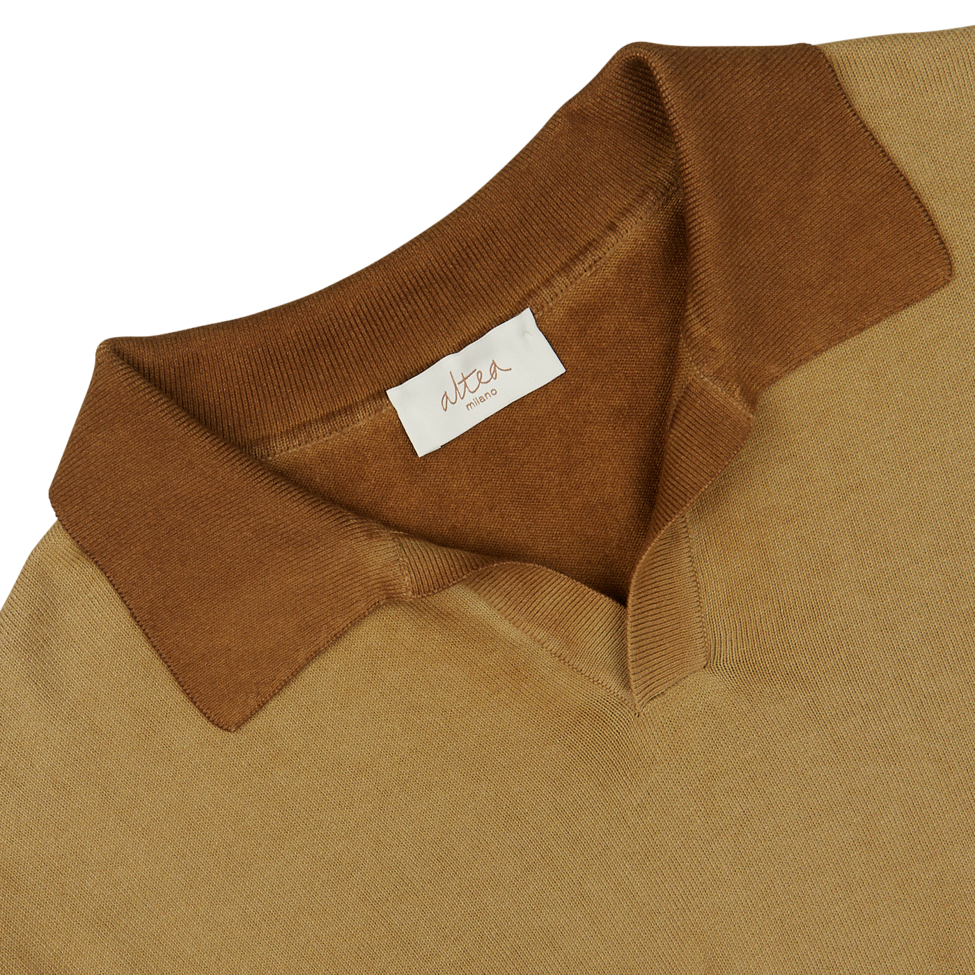 Close-up of a light brown, Altea garment-dyed sweater collar with a white label.