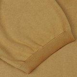Close-up of a textured Light Brown Dyed Cotton Capri Collar Polo Shirt in mustard yellow by Altea with a folded hem.
