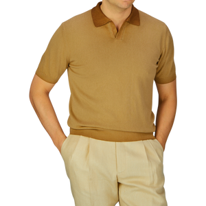 Man wearing an Altea seasonal tan polo shirt with a brown collar and garment-dyed light-colored trousers.