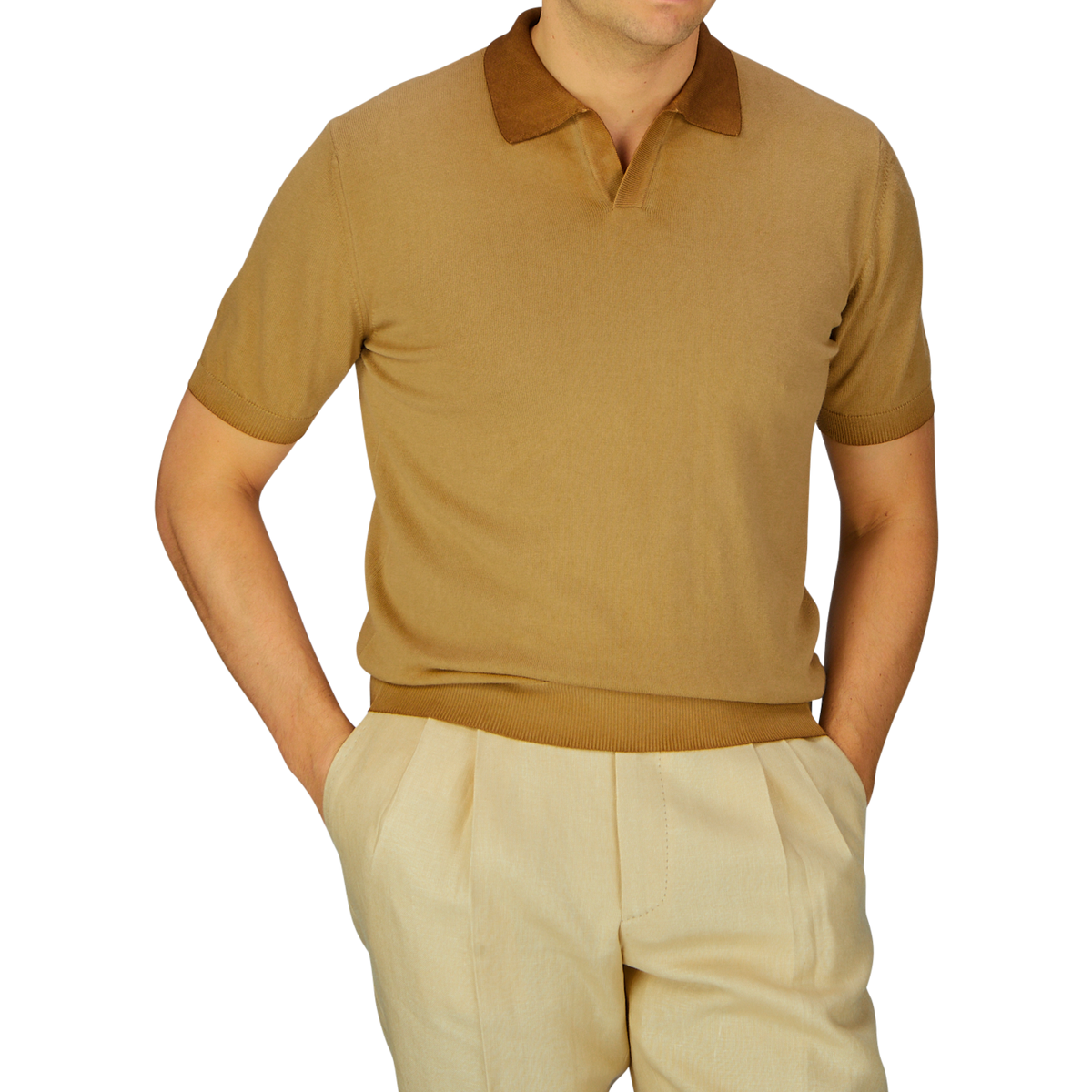 Man wearing an Altea seasonal tan polo shirt with a brown collar and garment-dyed light-colored trousers.