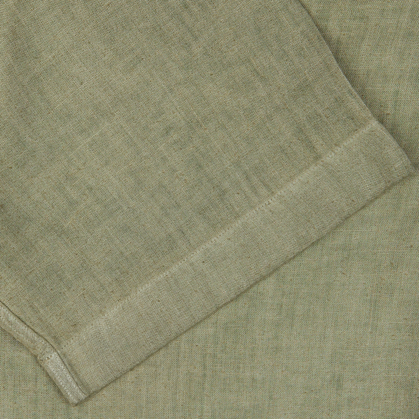 Close-up of a folded Altea Moss Green Linen Blend Camp Collar Shirt with a textured weave.