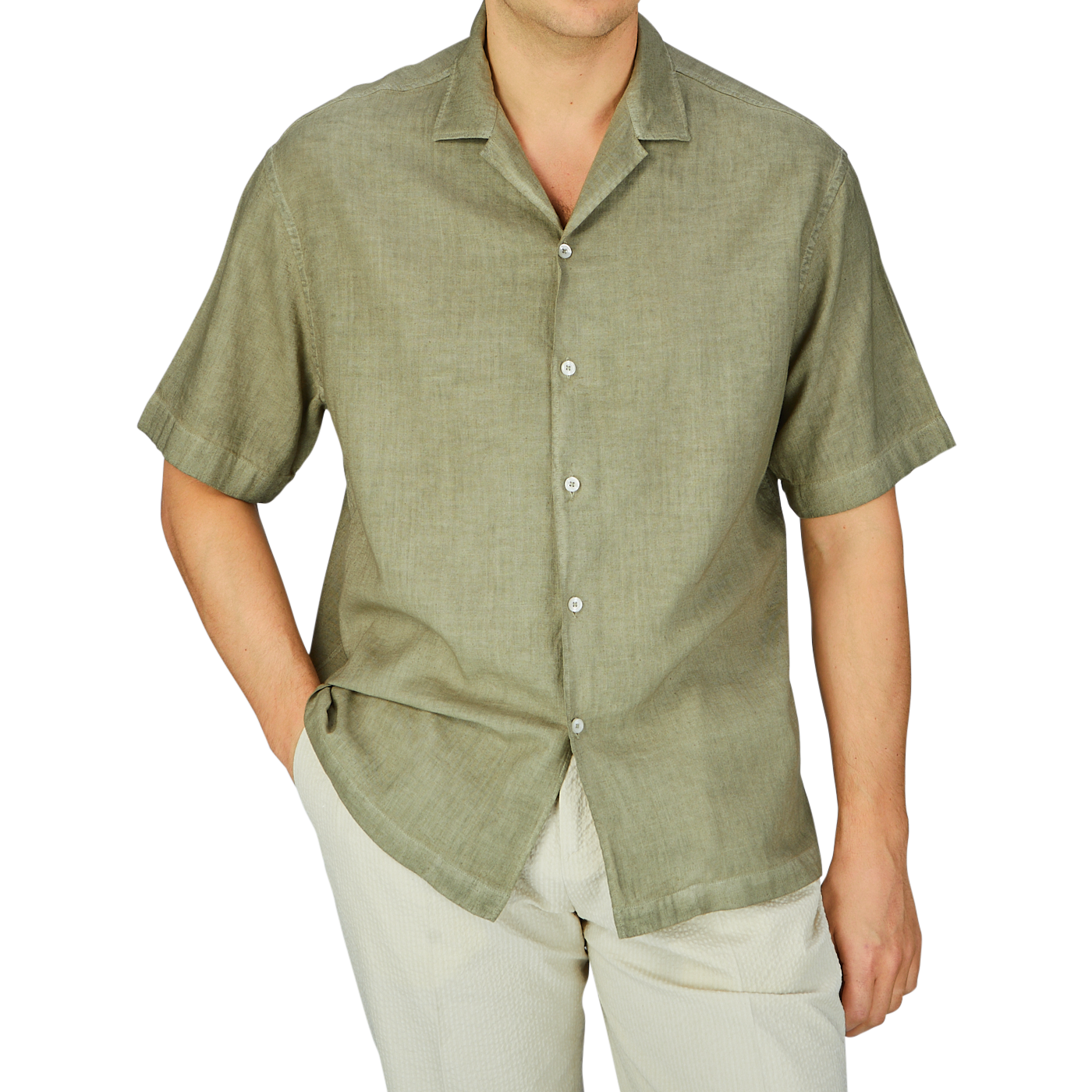 Man wearing a casual Altea Moss Green Linen Blend Camp Collar Shirt and light trousers, ideal as a summer essential.