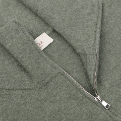 Close-up of an Altea Moss Green Wool Fleece 1/4 Zip Sweater, crafted from a cozy wool blend and featuring a visible label on the inside collar.