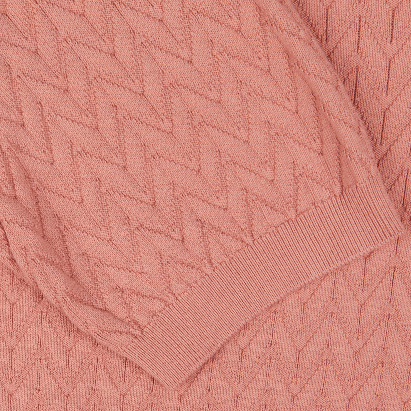 Close-up of a Altea muted pink cotton capri collar polo shirt with a ribbed cuff detail.