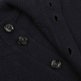 Close-up of the Altea Navy Blue Shetland Wool Button Cardigan highlighting its luxurious shetland wool material, complete with three buttons and a ribbed fabric texture.