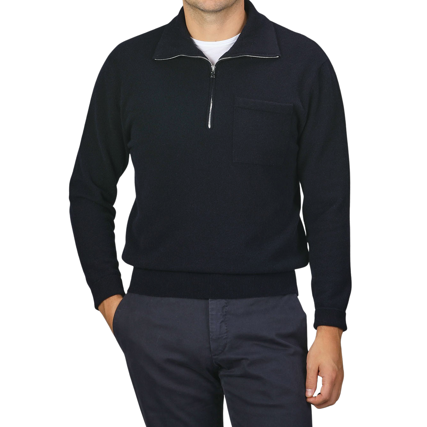 A person wearing a Navy Blue Wool Fleece 1/4 Zip Sweater by Altea, with a small chest pocket, paired with dark pants. The face is not visible.