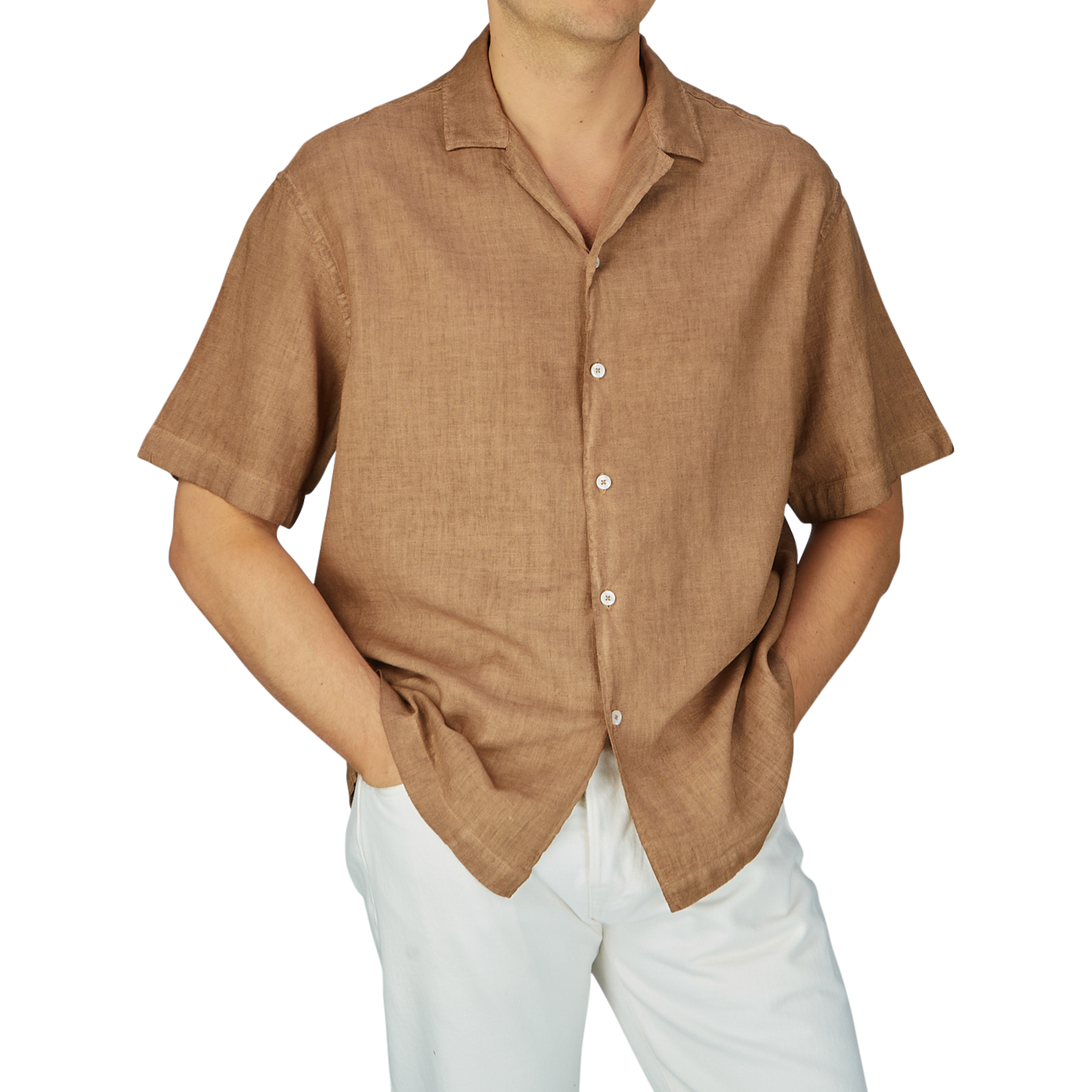 Man wearing an Altea Tobacco Brown Linen Blend Camp Collar Shirt with mother-of-pearl buttons and white pants, cropped at chest height.