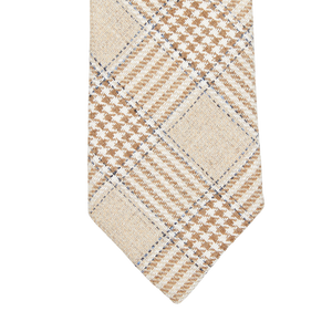 Close-up of a plaid, Amanda Christensen Brown Prince of Wales Wool Silk Lined Tie with a houndstooth pattern in neutral colors.