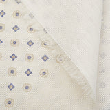 Close-up of a textured Cream Medallion Printed Linen Cotton Scarf with a fringe edge by Amanda Christensen.