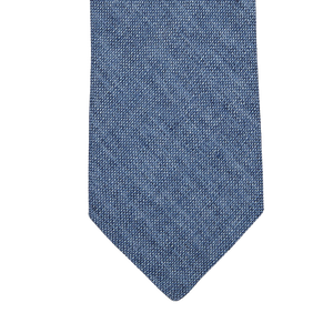 An Amanda Christensen Denim Blue Melange Linen Lined Tie in a denim blue shade on a white background.