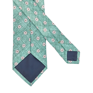 A Amanda Christensen green medallion print linen lined tie with flowers on it.