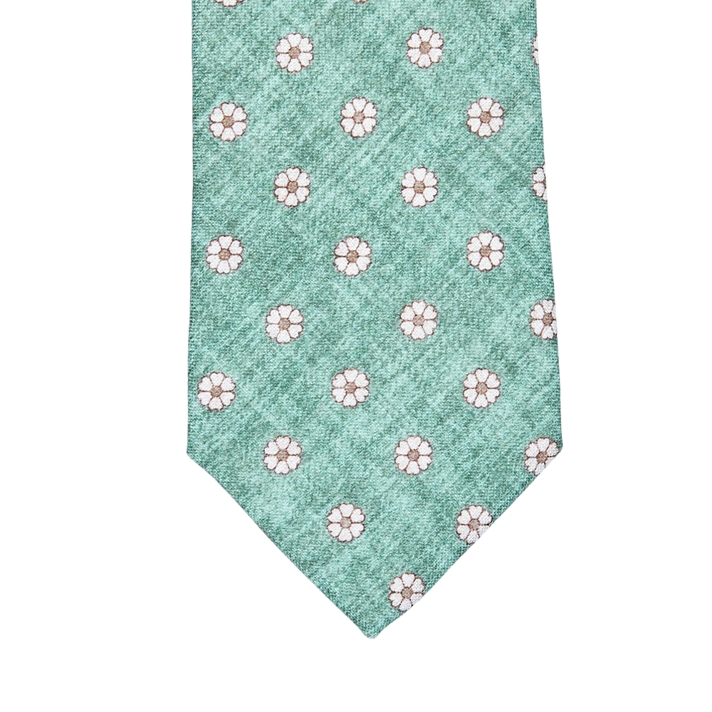 A Green Medallion Print Linen Lined Tie with white flowers on it by Amanda Christensen.